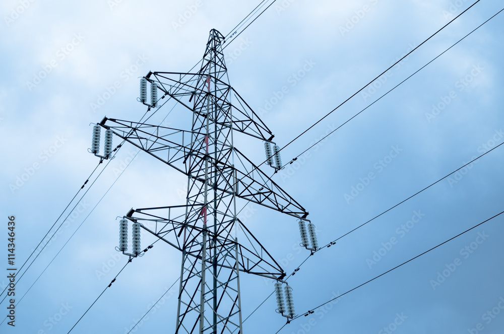 Electricity pylon with power lines against blue sky Electricity pylon with power lines against blue sky