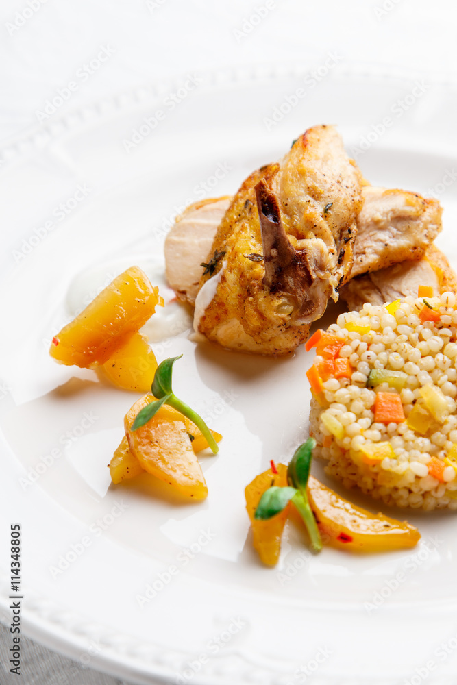 Fried chicken, served with pearl barley and vegetables Fried chicken, served with pearl barley and vegetables