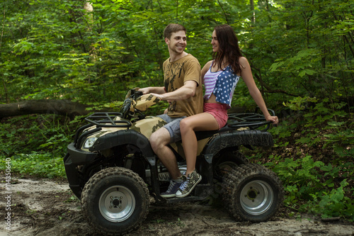 man and woman on an ATV