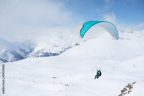 paragliding daytime in the mountainous areas