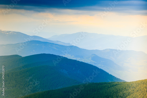 Landscape of misty mountain hills at distance.