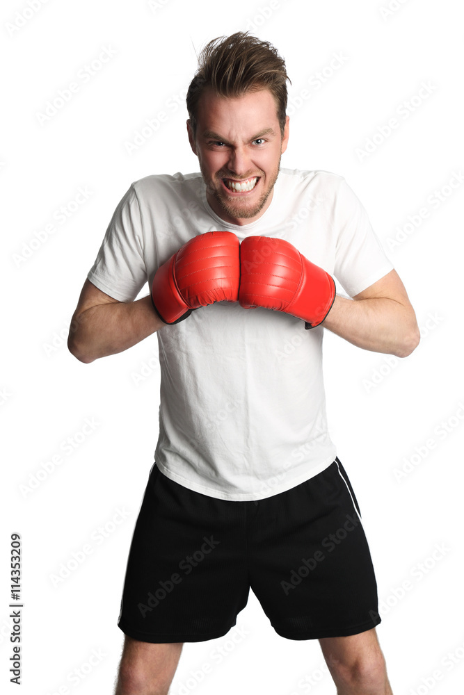 Attractive man wearing a white tshirt and black shorts with red boxing gloves, punching. White background. Attractive man wearing a white tshirt and black shorts with red boxing gloves, punching. White background.