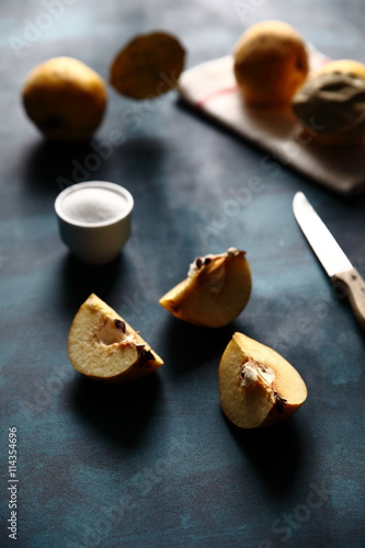 sliced quince on a blue background