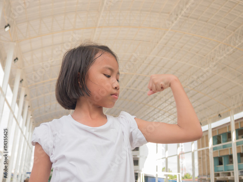 Happy Beautiful asian kids  with drawn muscles. Girl power and feminism concept. Sport concept. Strong superhero child.