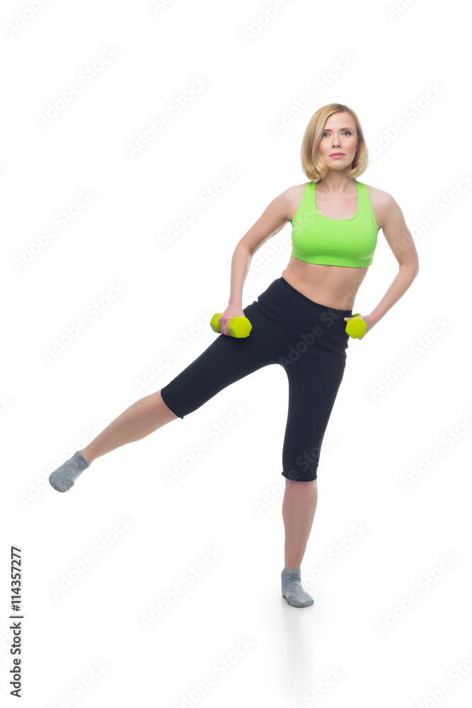 Beautiful woman doing sport exercise with dumbbells Beautiful woman doing sport exercise with dumbbells