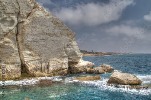 White chalky rocks cliff formations at Rosh Hanikra, mediterranean coast, HDR painterly effect