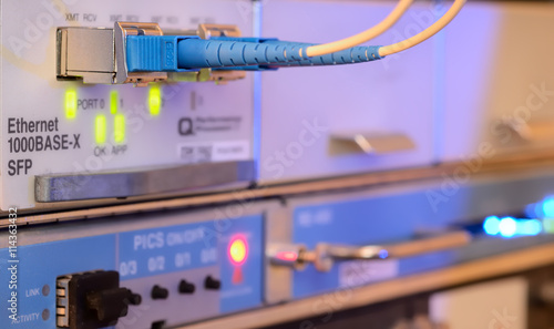 Fiber Optics with SC/APC connectors. Internet Service Provider equipment. Focus on fiber optic cables. Data Network Hardware Concept.