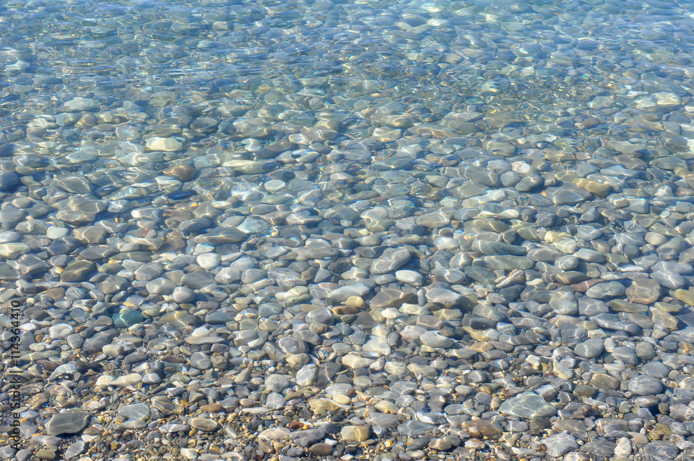 Natural Background, Stones Texture under a Transparent Sea Water