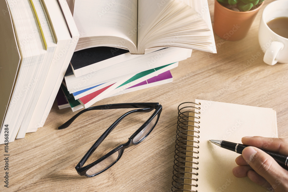 Stack of books on wooden table, Education background Stack of books on wooden table, Education background