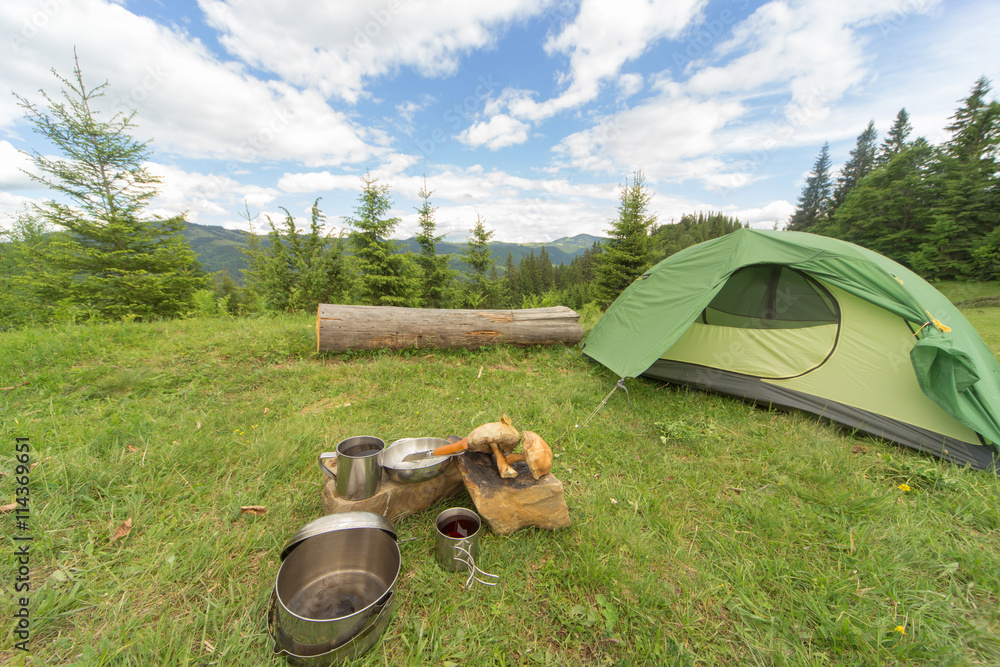 Camping in a mountainous area with cooking equipment. Camping in a mountainous area with cooking equipment.