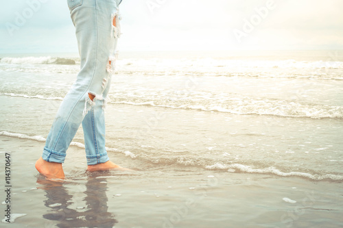 woman walking at seaside © sunpt