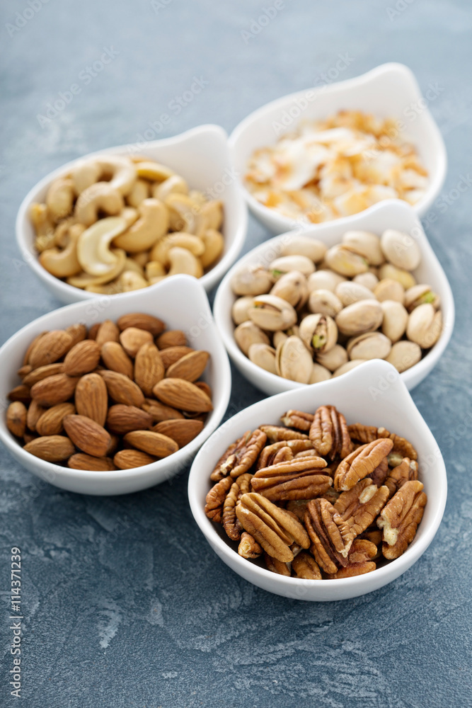 Variety of nuts in small bowls Variety of nuts in small bowls