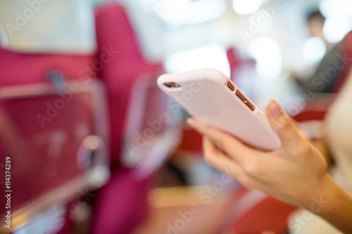 Woman use of cellphone inside ferry