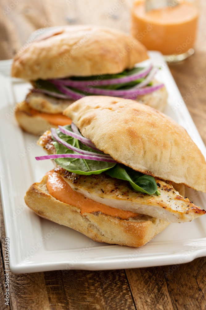 Grilled chicken sandwich with red pepper sauce