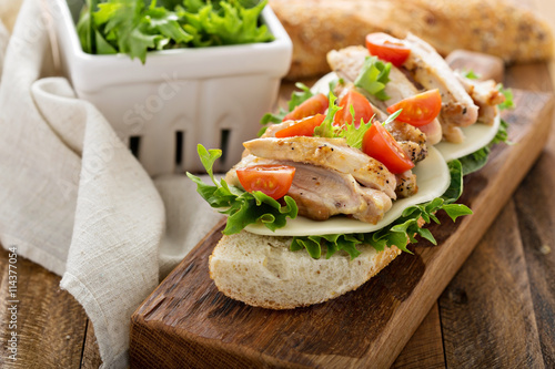 Grilled chicken sandwich with basil and tomatoes