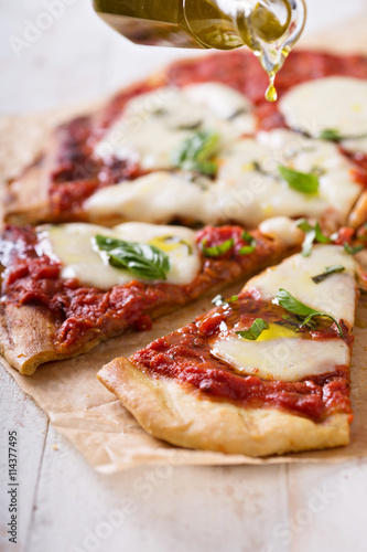 Grilled Margherita pizza with tomato sauce and mozzarella