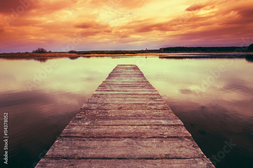 Old Wooden Pier, Calm River At Colorful Sunset Sunrise