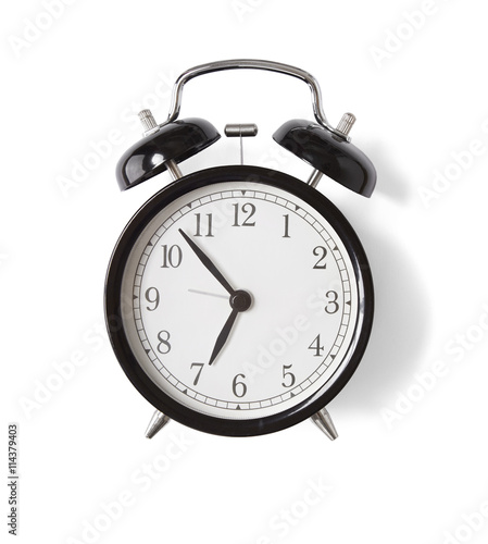 A black alarm clock isolated on a white background
