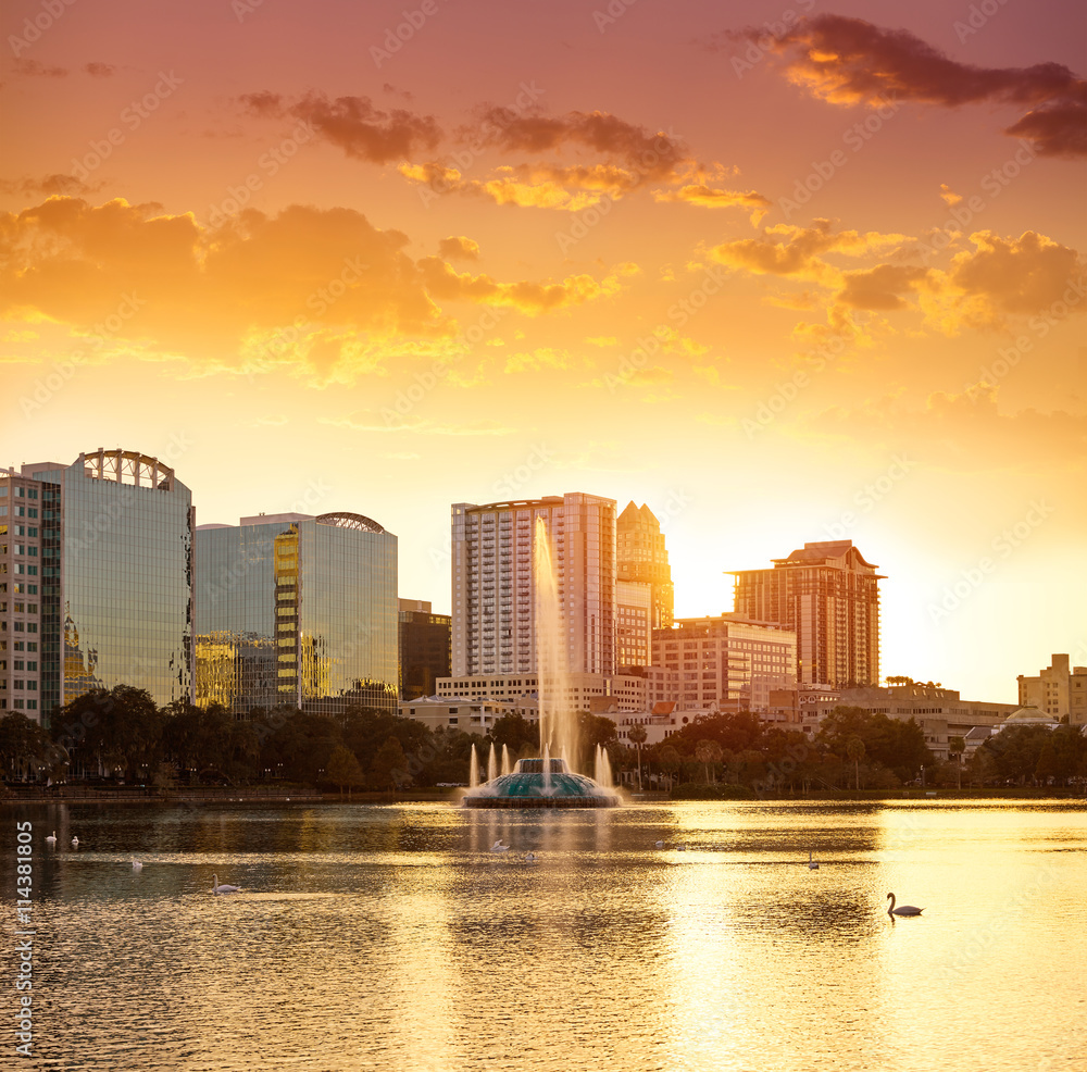Fototapeta premium Orlando skyline sunset at lake Eola Florida US