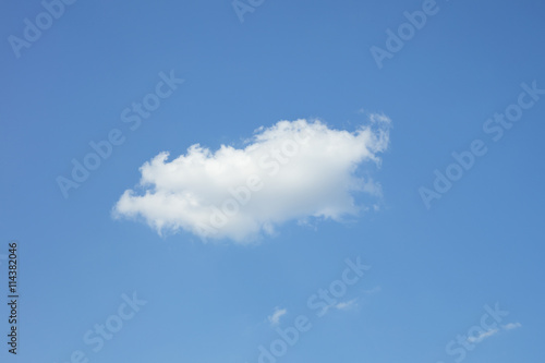 Single white cloud in the blue sky