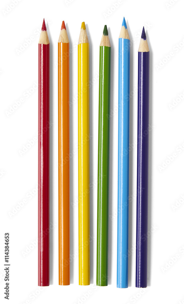 Artists tools and crayons - A selection of wooden coloring pencils isolated on a white background