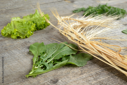 Organic food.wheat spica and ingredients for salad on old, rustic table