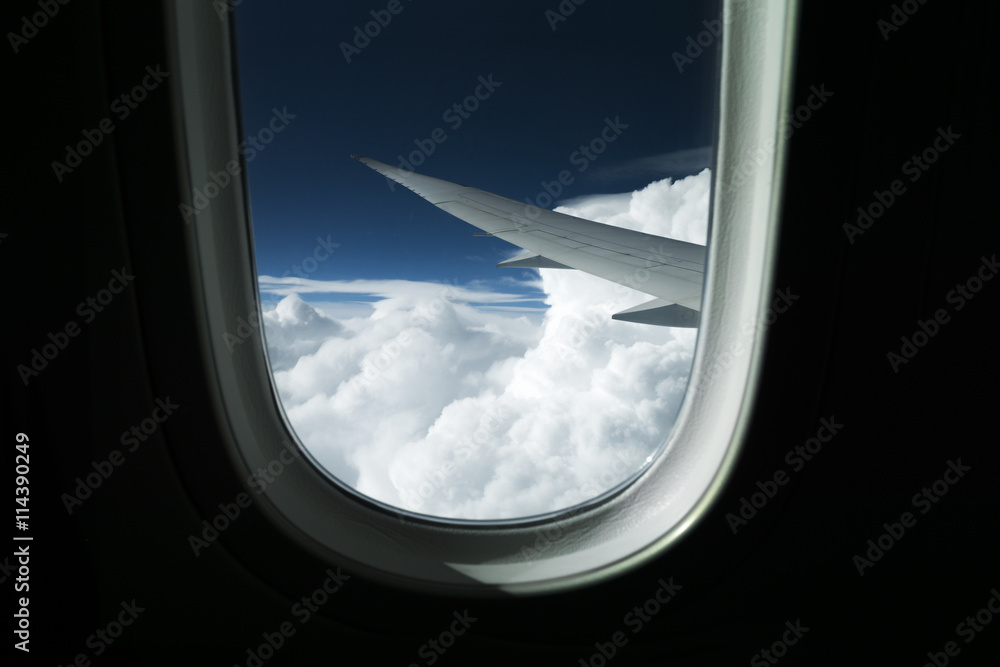 Wind and clouds view from a plane window early morning Wind and clouds view from a plane window early morning