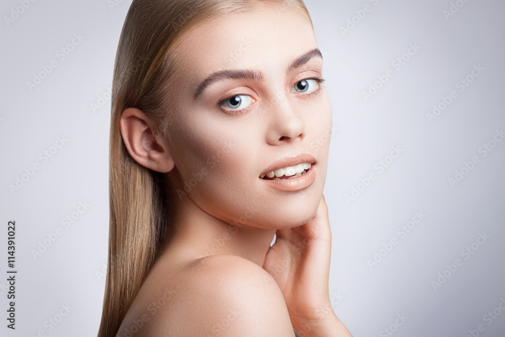 Portrait of a young beautiful blue-eyed girl. Beautiful make-up, perfectly smooth hair, blue eyes, open arms, perfect skin. Portrait of a young beautiful blue-eyed girl. Beautiful make-up, perfectly smooth hair, blue eyes, open arms, perfect skin.