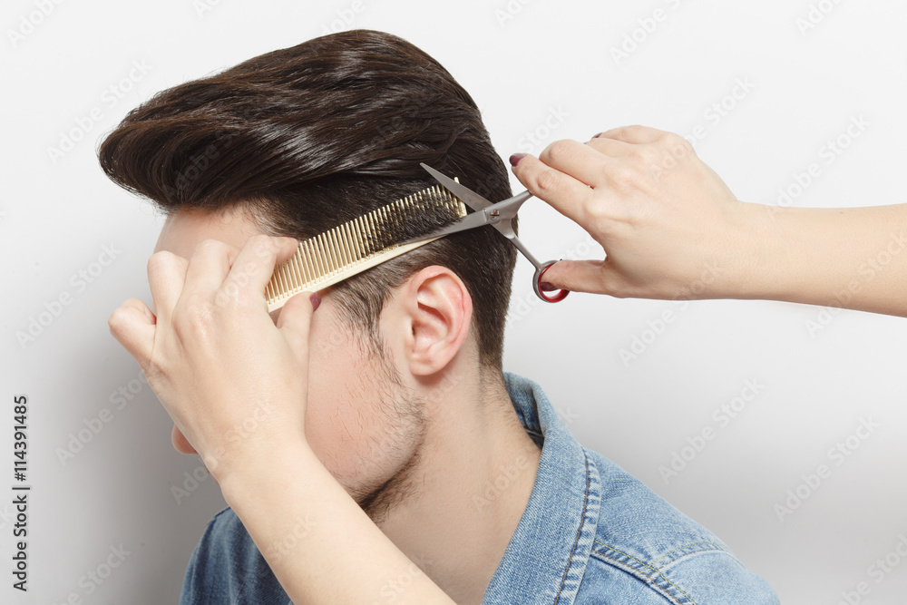 Φωτογραφία Portrait fo handsome man with black hair having haircut over white background