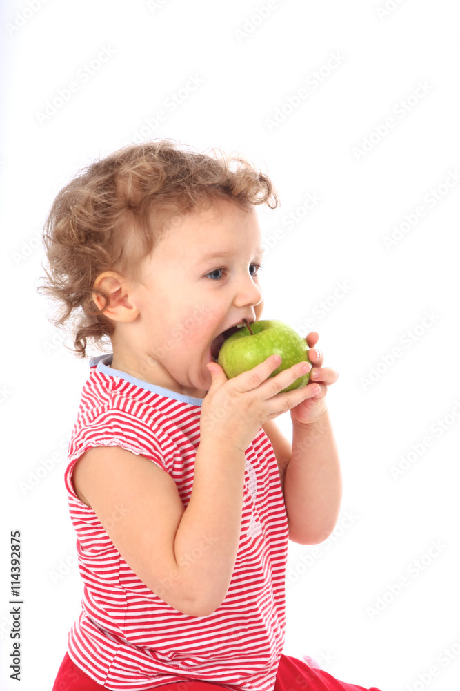 Small baby in red with green apple Small baby in red with green apple