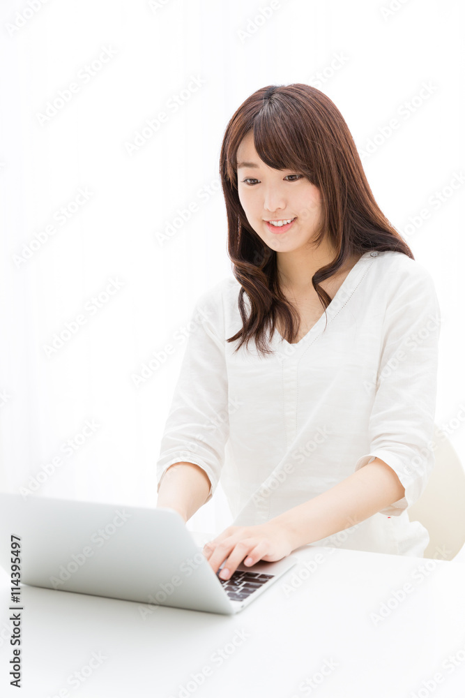 attractive asian woman using laptop computer attractive asian woman using laptop computer