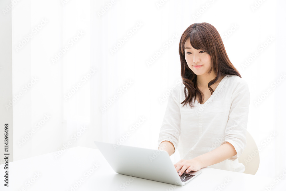 attractive asian woman using laptop computer attractive asian woman using laptop computer