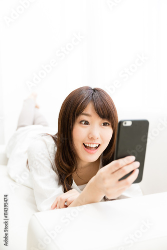 attractive asian woman using smart phone