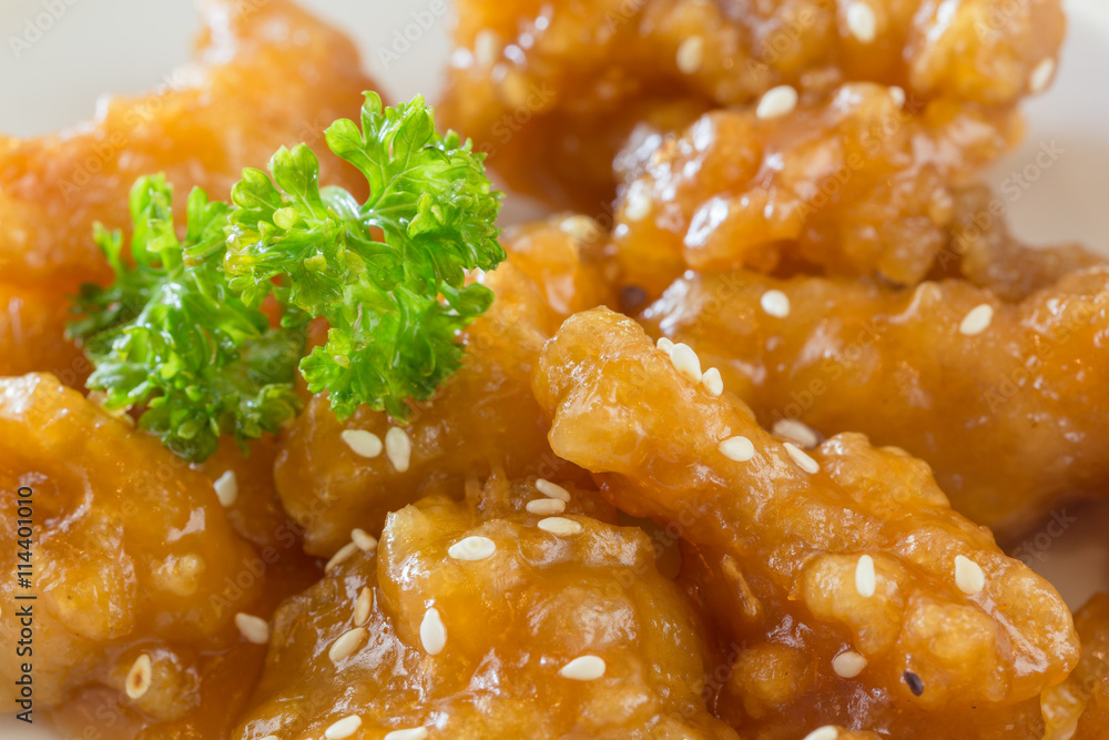 Deep-fried chicken with sesame seed in orange sauce. Deep-fried chicken with sesame seed in orange sauce.