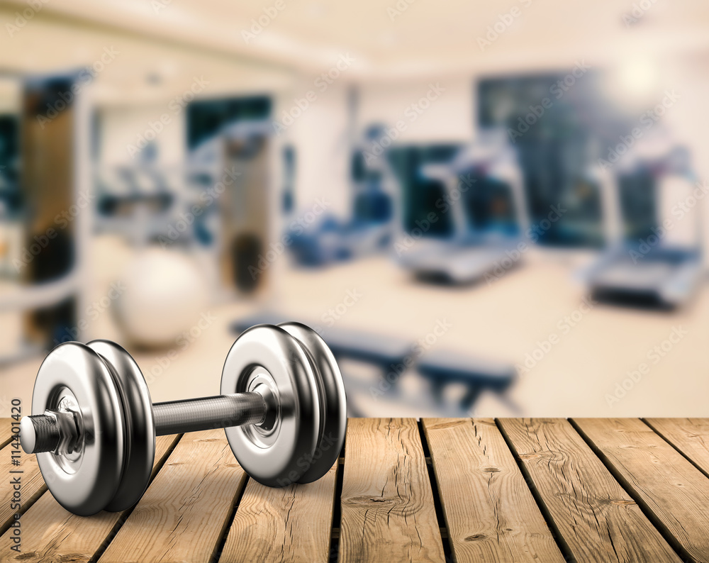 metal dumbbell with gym background Stock Photo | Adobe Stock
