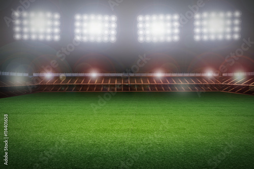 empty soccer field with stadium at night © phonlamaiphoto