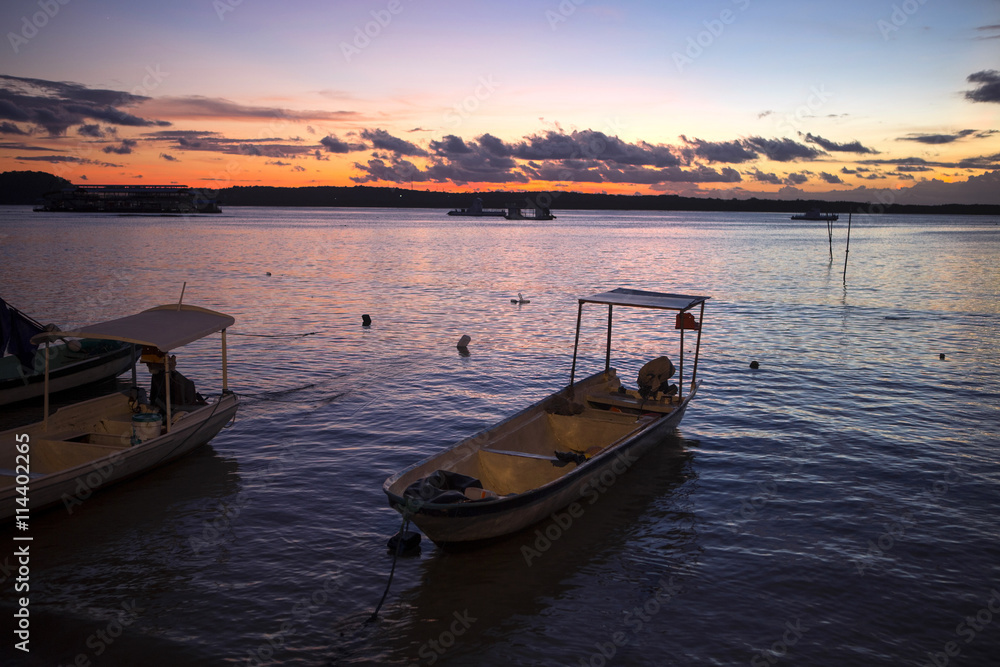 Sunset with boats in the foreground, Nusa Penida, Indonesia Sunset with boats in the foreground, Nusa Penida, Indonesia
