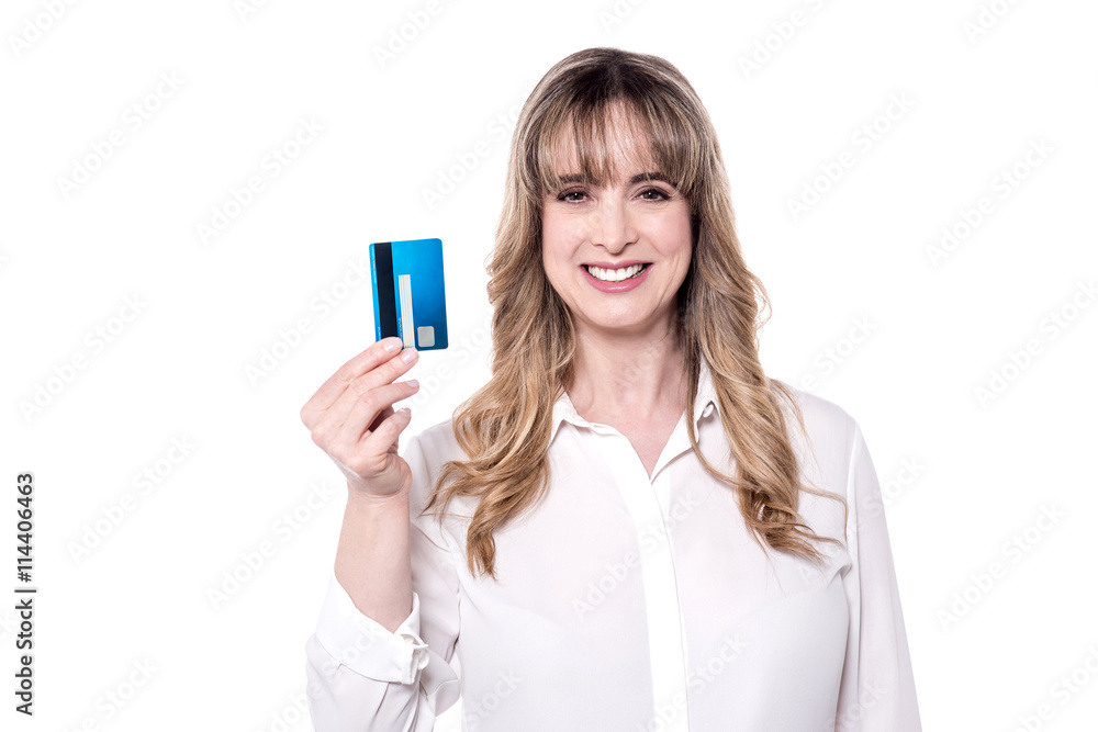 Happy woman holding a credit card. Happy woman holding a credit card.