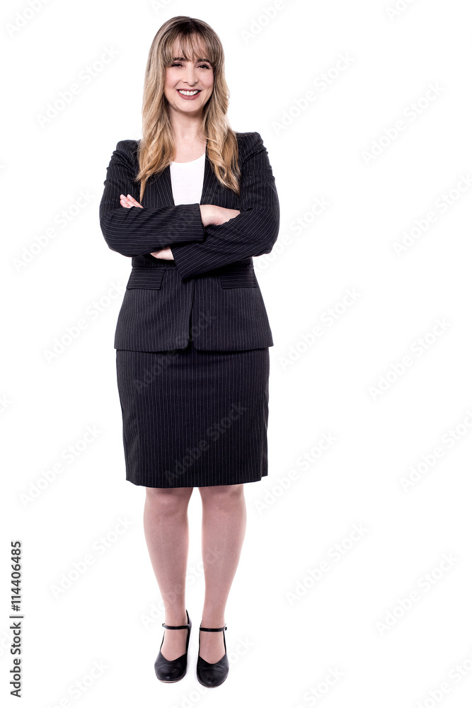 Confident female executive looking at camera. Confident female executive looking at camera.