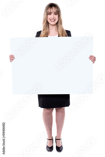 Business woman holding blank placard.