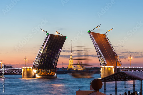 Defocused sailboat under the Palace bridge at night. Saint Petersburg