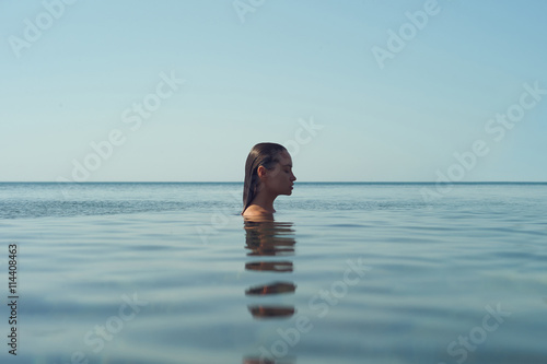 Beautiful elegant woman in the sea © Egor Mayer