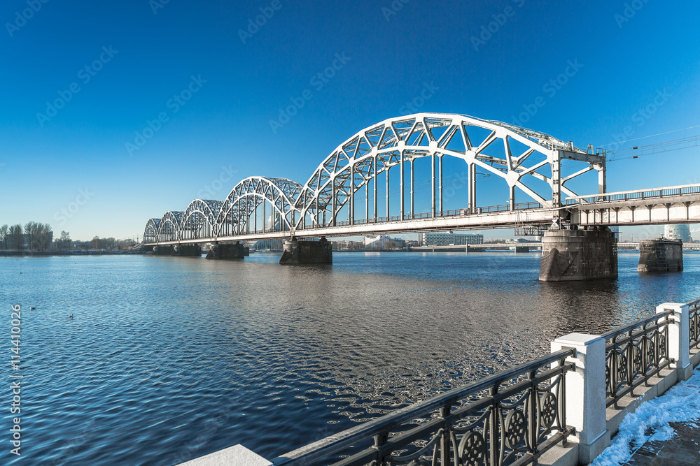 Naklejka premium A view of the Railway Bridge over Daugava River in Riga, Latvia