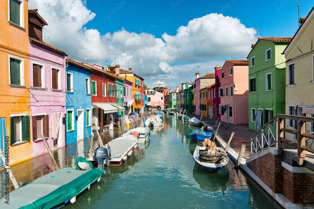Boats moored in a colorful canal, Burano, Venice