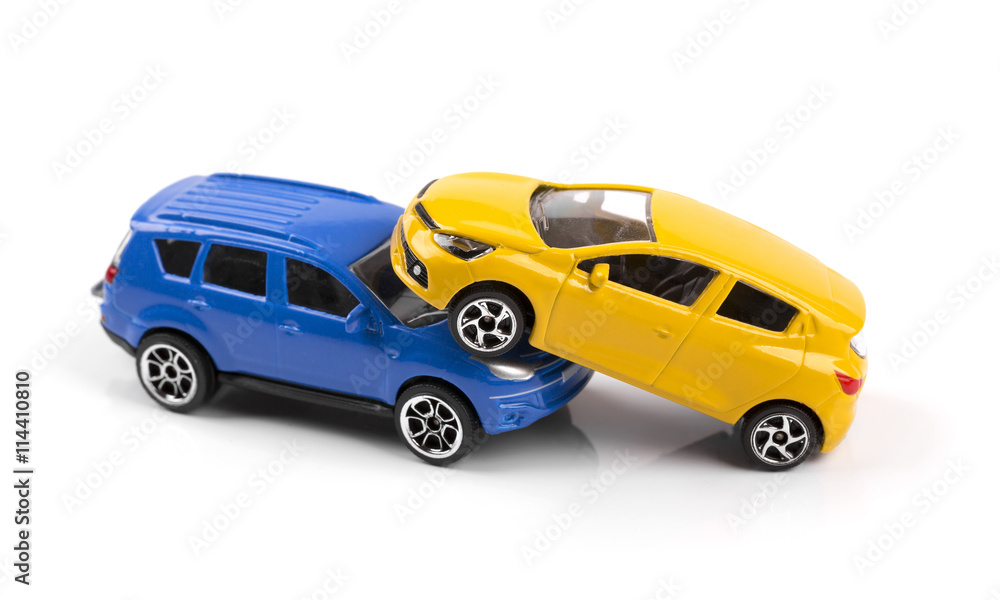 car accident concept, two toy cars isolated on white