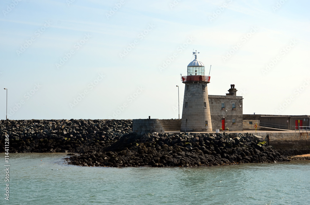 lighthouse in small port on Howth peninsula in Ireland lighthouse in small port on Howth peninsula in Ireland