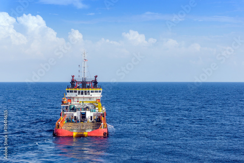 Anchor handling tug in the open sea at oilfield