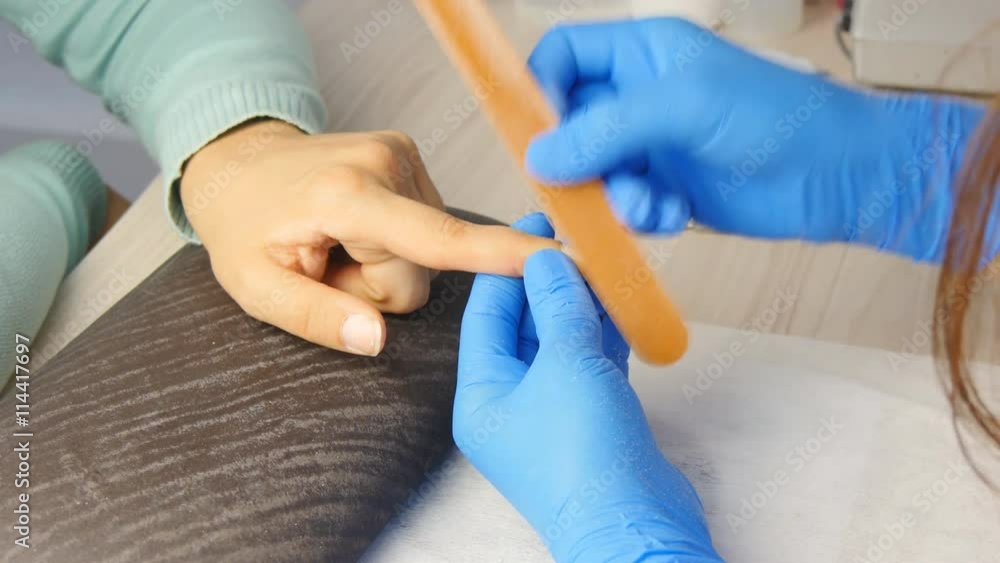 Girl makes a manicure in the salon Girl makes a manicure in the salon