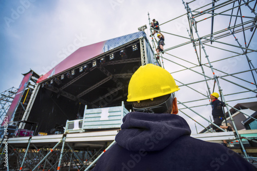 building entertainment stage for music festival wearing safety c