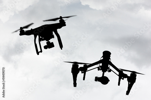 Fototapeta Naklejka Na Ścianę i Meble -  Drone with 4K camera flying.